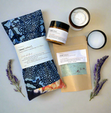 Tribal Marks Bundle of thr Ankara Herbal Aromatherapy Pillow, Magnesium lotion jars, Magnesium foot soak flat layed with lavender sprigs