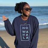 Woman on the beach wearing Tribal Marks’ No Wahala African Ankara Graphic Print Crewneck sweatshirt in navy blue with inspiring hope quote to fight anxiety
