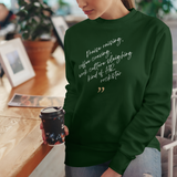 woman-wearing-Tribal Marks Team design HR culture sweatshirt, holding a cup of cup