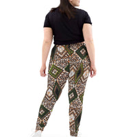 Back view of a woman wearing Tribal Marks' The Proverb Ankara Print Graphic Women's Ankara Joggers
